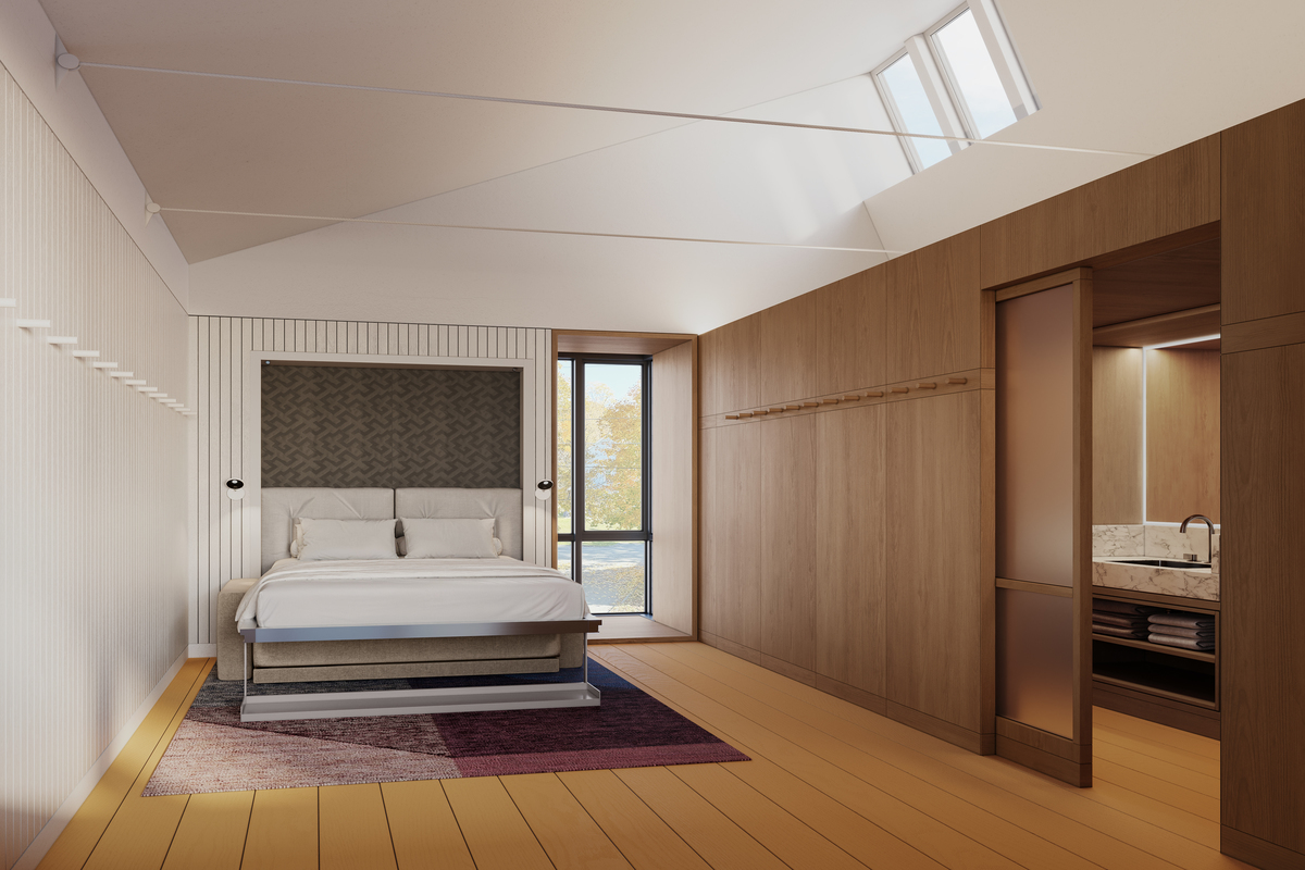 Modern bedroom with a queen bed, large window, wood paneling, skylights, and an adjacent bathroom.