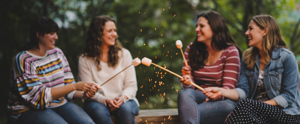 group of girls at Porches with smores by the fire
