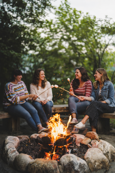 group of girls at Porches with smores by the fire