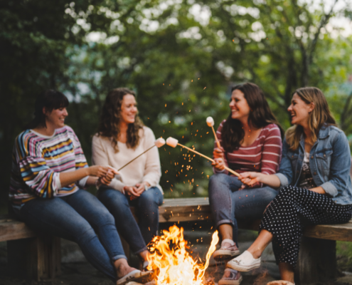 group of girls at Porches with smores by the fire